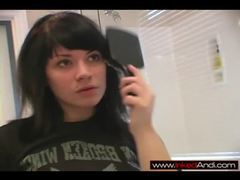 Cute raven haired teen teasing in the mirror