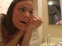 Cute teen does her makeup and talks dirty