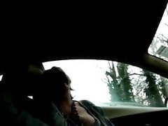 Mature wife gives good suck to man on car