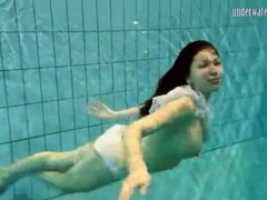 Girl in white panties swims in pool videos