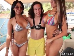 Bikini girls flash fat asses on a boat tubes