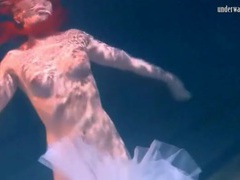 Cute ballerina swims in her shoes and tutu videos