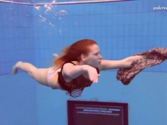 Curly red hair girl swims in her panties movies at freekilomovies.com