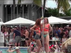 Topless dancing amateurs at a pool party