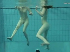 Two nude hotties swimming and touching movies at freekilomovies.com