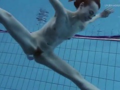 Sexy trimmed pussy on a tall teen swimming in the pool