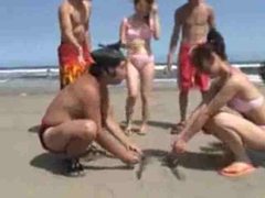 Japanese girls wrestling on the beach tubes at lingerie-mania.com