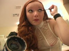 Hot redhead puts on her makeup