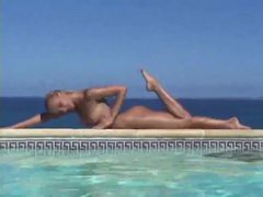 Blonde strips from bikini and takes a dip