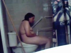 Chubby chick uses shower head to masturbate clip