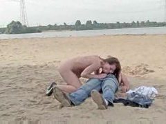 Naked girl sucks him and rides him at beach