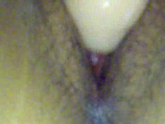 Close up on her young pussy during dildo play