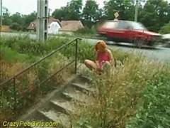 Girl takes a piss next to a public street videos