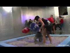 Girls jousting and wrestling in the mud
