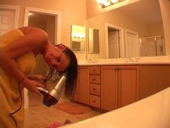 Hot chick does her hair after a shower