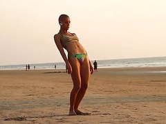 The bald yogi girl on the beach