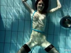 MistTube presents: Beautiful slim brunette swims in black stockings