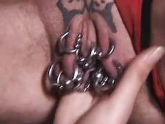Pierced granny with lots of genital piercings fisted