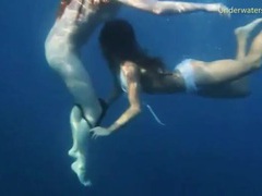 MistTube presents: Bikini girls swim in the ocean and strip