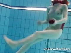 sGirls presents: Redhead mia stripping underwater