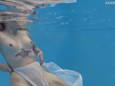 Finnish babe swims nude in the pool