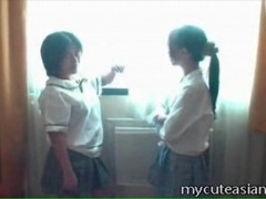 LovelyClips presents: Amateur asian schoolgirls kiss tits in hotel room