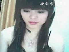 Adorable asian teases her tits on webcam