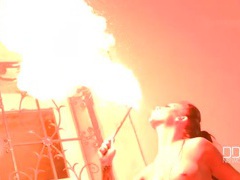 Topless big tits girl plays with fire