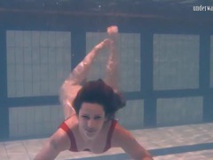 DirtySexNet presents: Swimming brunette in one piece swimsuit