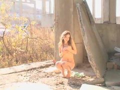 AlphaErotic presents: Stunning teen girl stripping outdoors