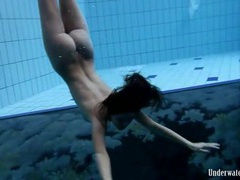 Naked swimming scene starring a busty beauty
