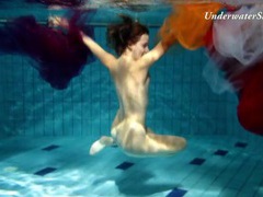 Artful naked underwater show with a hairy pussy girl
